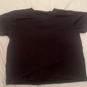 Black Lululemon tee, with mini holes ( it’s not see through though!)